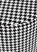Elegancka pufa Aruna - czarno-biała z chromowaną podstawą